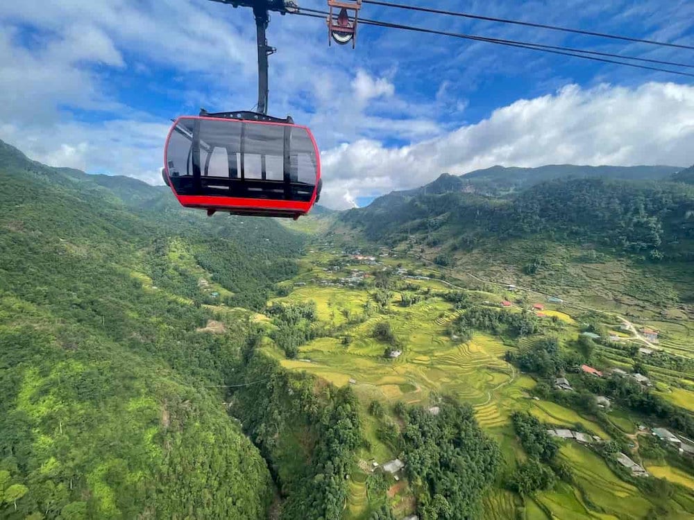 The modern Sapa cable car system offers breathtaking panoramic views as it ascends to Fansipan's summit 